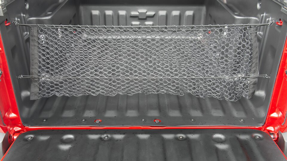 Organiza tu caja de carga con la red vertical para Chevrolet Montana 2024