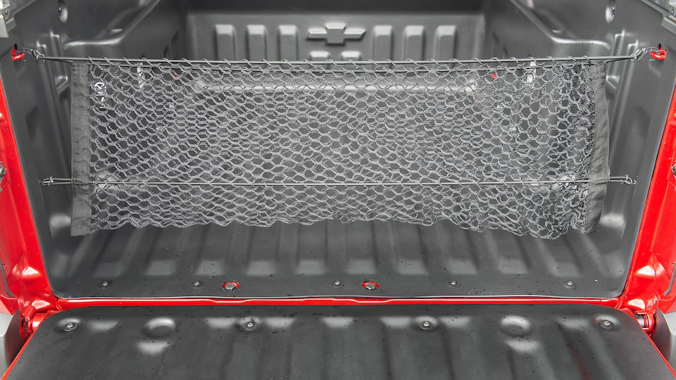 Organiza tu caja de carga con la red vertical para Chevrolet Montana 2025